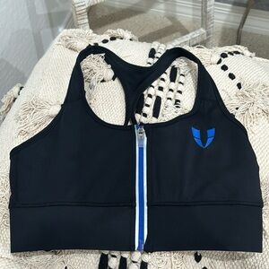 Black and blue firmabs zipup sports bra. USA size M, China size L.